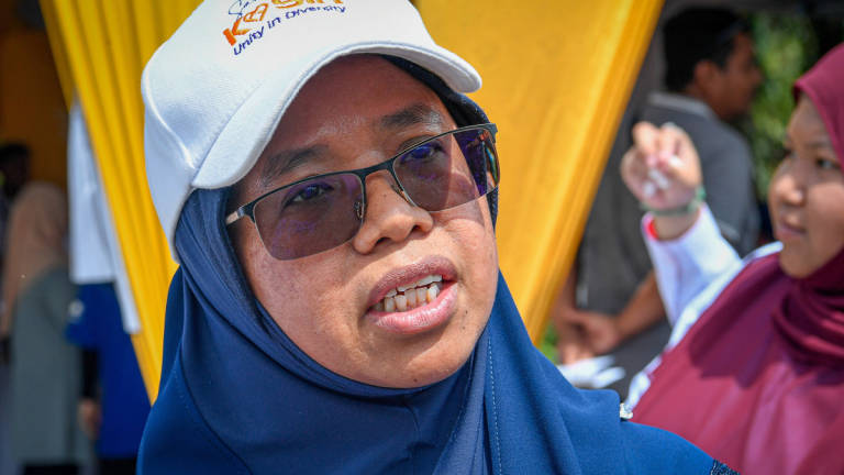 Deputy Minister of Housing and Local Government, Datuk Aiman Athirah Sabu, speaks at a press conference during the People’s Friendly Home Key Handover Ceremony in Kampung Sungai Kelambu, Banting, today. – BERNAMA