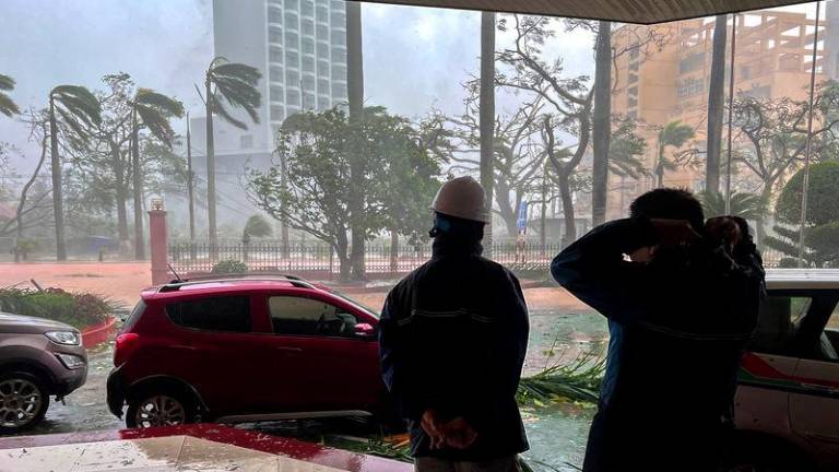 Rescue workers stand due to the impact of Typhoon Yagi, in Do Son district, Hai Phong city, Vietnam, September 7, 2024. REUTERSPIX