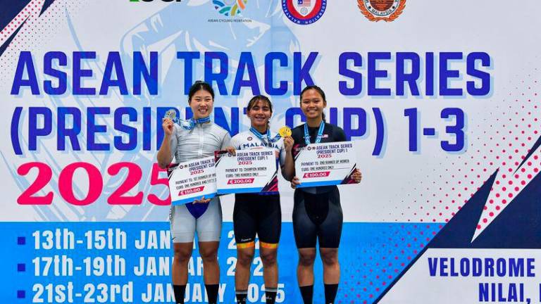 Malaysia’s Gold medalist Nurul Izzah Izzati Mohd Asri (centre) poses on the podium with Korea Silver medalist Haeun Kim (left) and Malaysia Bronze medalist Nur Alyssa Mohd Farid (right) in Elite Women's Sprint event on the ASEAN Track Series 2025 President Cup 1 at the National Velodrome in Nilai, today. - BERNAMAPIX