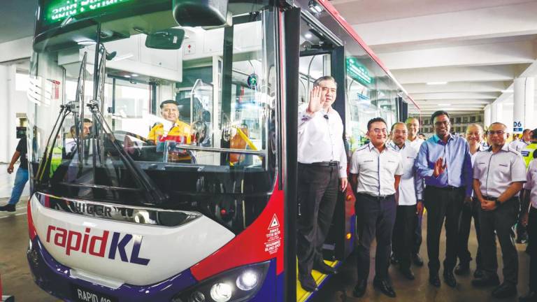 Loke (left) and Prasarana president and group CEO Mohd Azharuddin Mat Sah (second, left) at the unveiling ceremony of new diesel buses at the Rapid Bus Complex Batu Caves. – Bernamapic