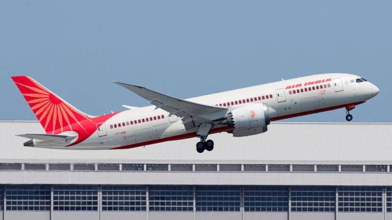 Air India Boeing 787 Dreamliner aircraft with registration letters VT-ANB flies over Tokyo, Japan, April 27, 2025 in this picture obtained from social media. - REUTERSPIX
