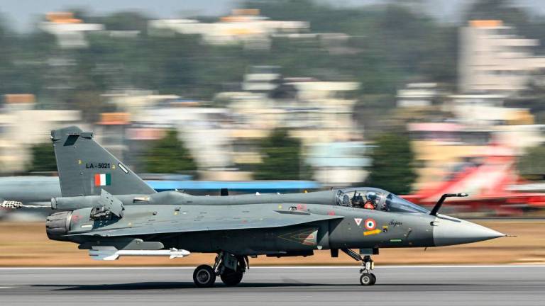 The Indian Air Force (IAF) HAL Tejas fighter jet prepares to take off during Aero India 2025, a military aviation exhibition at the Yelahanka Air Force Station in Bengaluru on February 13, 2025. (Photo by Idrees MOHAMMED / AFP)