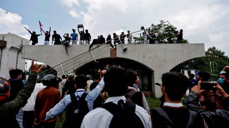 Demonstrators gather at the entrance of the Parliament during a protest against corruption and government’s decision to block several social media platforms, in Kathmandu, Nepal September 8, 2025. REUTERS/Navesh Chitrakar
