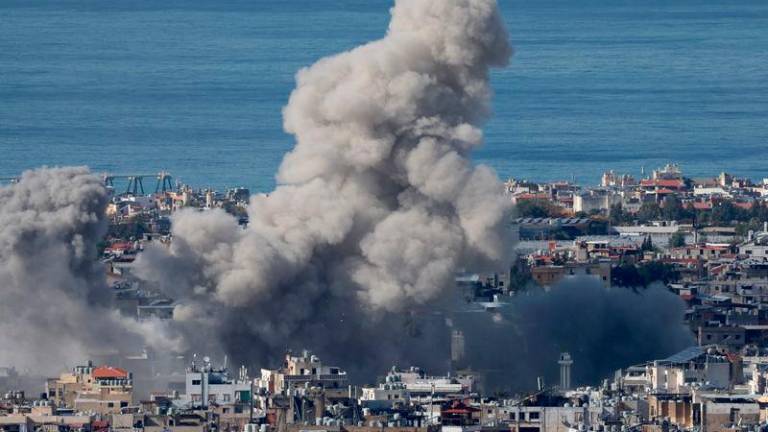 Smoke billows over Beirut’s southern suburbs, after an Israeli strike, amid the ongoing hostilities between Hezbollah and Israeli forces, as seen from Baabda, Lebanon - REUTERSpix