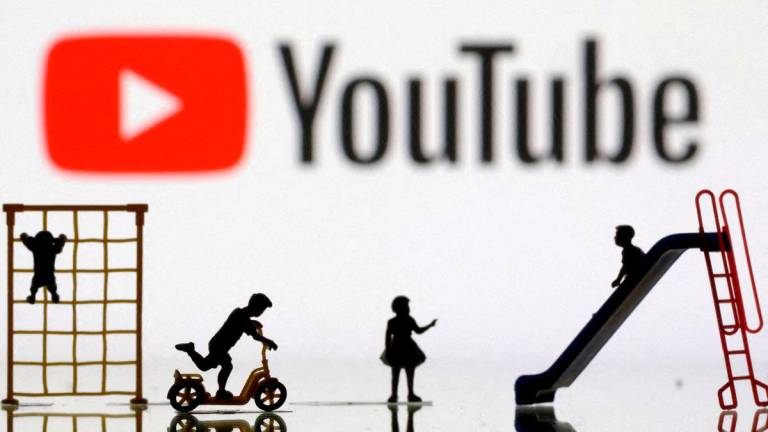 FILE PHOTO: Children playground miniatures are seen in front of displayed YouTube logo in this illustration taken April 4, 2023. REUTERS/Dado Ruvic/Illustration/File Phot