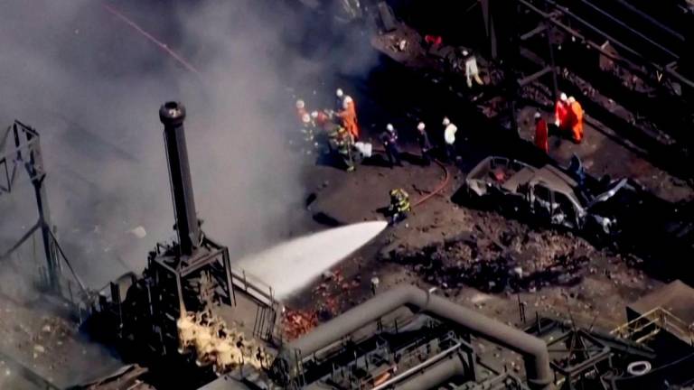 Firefighters spray water on the site of an explosion at U.S. Steel's Clairton Coke Works plant in Clairton, Pennsylvania, U.S. August 11, 2025 in this screengrab obtained from an aerial video. - ABC Affiliate WTAE via REUTERSPIX