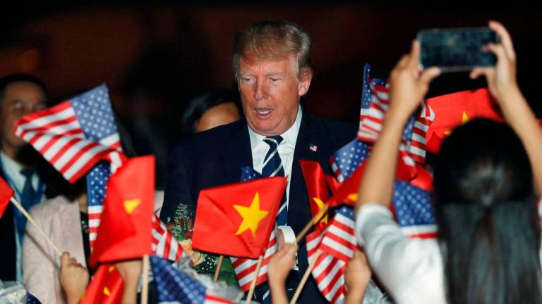 U.S. President Donald Trump arrives aboard Air Force One at Noi Bai International Airport in Hanoi, Vietnam November 11, 2017. REUTERSpix
