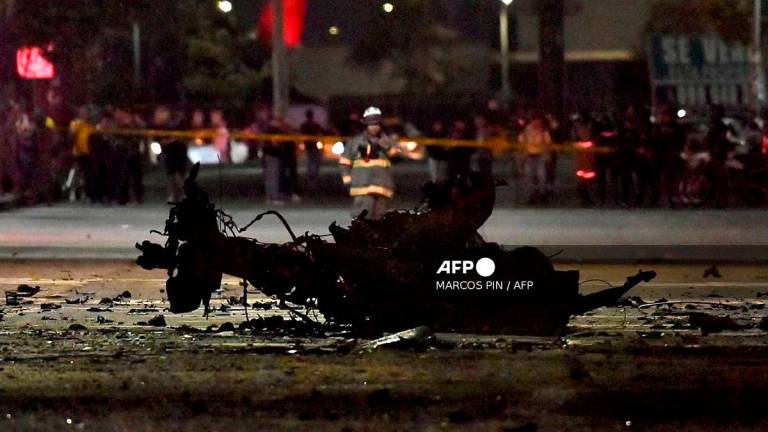 The remains of a suspected car bomb that exploded in front of a shopping center are pictured in the north of Guayaquil, Ecuador on October 14, 2025. - Marcos Pin / AFP