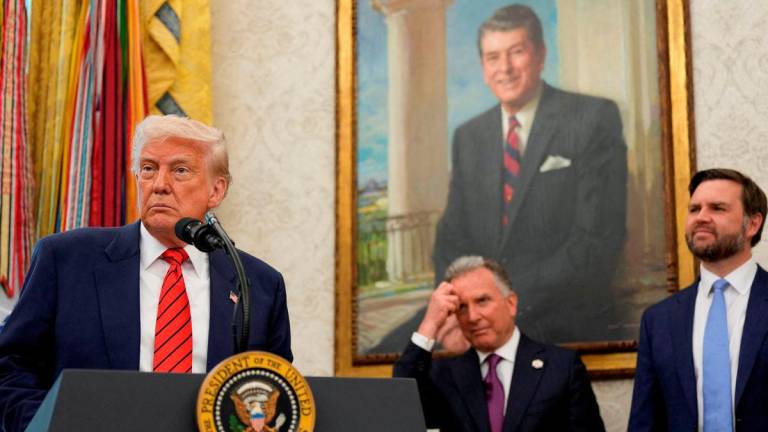 FILE PHOTO: U.S. President Donald Trump speaks during a swearing-in ceremony of Special Envoy Steve Witkoff in the Oval Office at the White House in Washington, D.C., U.S., May 6, 2025. REUTERS