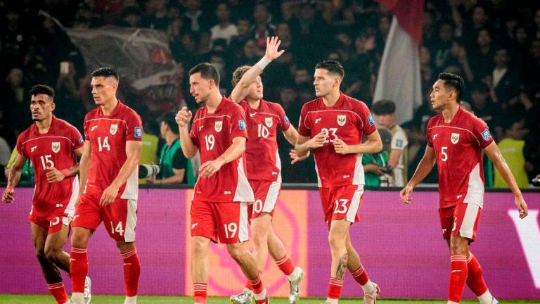 Indonesia’s forward #10 Ole Lennard Romenij waves to supporters after scoring his team’s first goal during the FIFA World Cup 2026 Asian qualifier football match between Indonesia and China at Gelora Bung Karno Stadium in Jakarta on June 5, 2025. AFP
