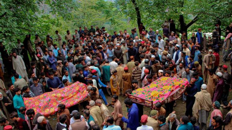 Residents attend the funeral of the victims of a cloudburst that triggered heavy rains and flooding in Naryan Behak village on the outskirts of Muzaffarabad, the capital of Pakistani-administered Kashmir, August 15, 2025. REUTERS/Naseer ud Din