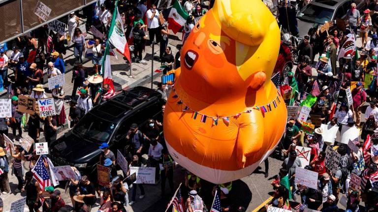 A 20-foot (6m)-tall balloon of US President Donald Trump in a diaper is seen among people taking part in a “No Kings” protest in Los Angeles, AFPpix