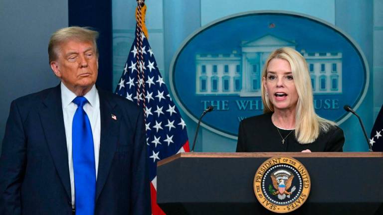 US Attorney General Pam Bondi (R) speaks during a news conference with President Donald Trump in the Brady Briefing Room of the White House - AFP