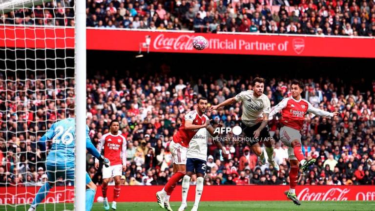 Arsenal's Spanish defender #36 Martin Zubimendi (R) scores the team's third goal during the English Premier League football match between Arsenal and Nottingham Forest at the Emirates Stadium in London on September 13, 2025. - AFP