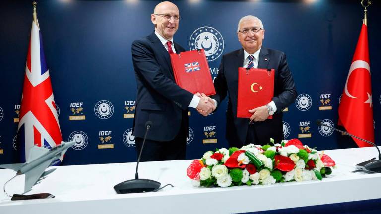 Turkish Defence Minister Yasar Guler and British Defence Secretary John Healey attend a signing ceremony on the sidelines of the International Defence Industry Fair (IDEF) in Istanbul, Turkey, July 23, 2025. - REUTERS/Dilara Senkaya