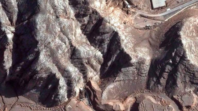 This handout satellite picture shows damage caused by recent airstrikes on nearby tunnel entrances near Isfahan nuclear enrichment facility in central Iran. With his surprise announcement of a ceasefire between Israel and Iran, US President Donald Trump has turned his flair for social media into diplomatic deftness, despite continued uncertainty in the Middle East. - AFP PHOTO/ SATELLITE IMAGE ©2025 MAXAR TECHNOLOGIES