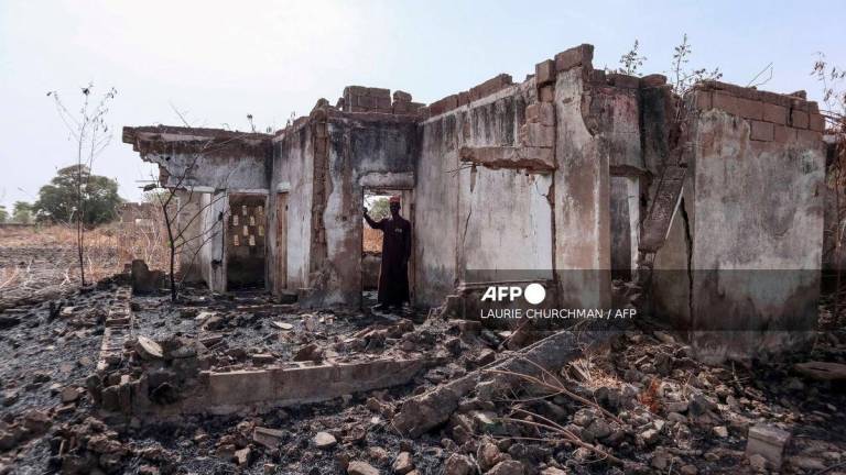 For representational purposes only - This photograph taken on March 31, 2024 shows Vice Principal Bature Sule surveying the wreckage of a dormitory destroyed by Boko Haram fighters at the Chibok Government Girls Secondary School in 2014. A decade since Nigeria’s most infamous mass abduction, almost 100 of the 276 girls seized from their school in Chibok by Boko Haram fighters are still thought to be in captivity.