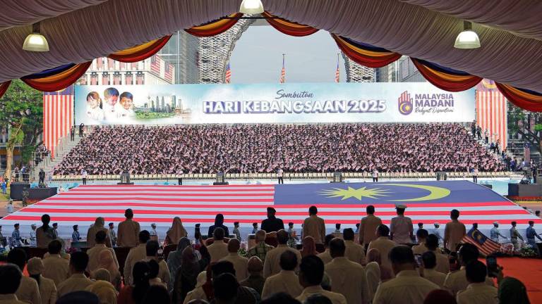 A contingent of 120 cadet officers from the National Defence University of Malaysia marched with a giant Jalur Gemilang measuring 80 by 40 feet during the 2025 National Day celebration at Dataran Putrajaya today. - BERNAMA