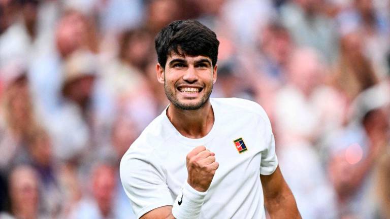Spain’s Carlos Alcaraz celebrates winning a game against Russia’s Andrey Rublev during their men’s singles fourth round tennis match on the seventh day of the 2025 Wimbledon Championships at The All England Lawn Tennis and Croquet Club in Wimbledon, southwest London, on July 6, 2025. - AFP