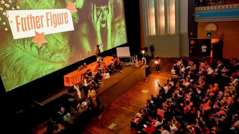 Taylor Swift fans listen to a song during a listening event for Swift’s new album ‘The Life of a Showgirl’ at the Astor Theatre in Melbourne on October 3, 2025. (Photo by William WEST / AFP)