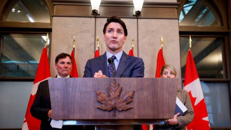 Canada’s Prime Minister Justin Trudeau, with Minister of Foreign Affairs Melanie Joly, and Minister of Public Safety, Democratic Institutions and Intergovernmental Affairs Dominic LeBlanc, takes part in a press conference about the Royal Canadian Mounted Police’s investigation into “violent criminal activity in Canada with connections to India”, on Parliament Hill in Ottawa, Ontario, Canada October 14, 2024. REUTERS.