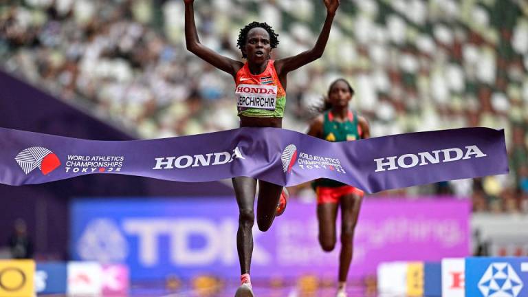 Kenya’s athlete Peres Jepchirchir crosses the finish line to win the women’s marathon final during the World Athletics Championships in Tokyo on September 14, 2025. - Jewel SAMAD / AFP