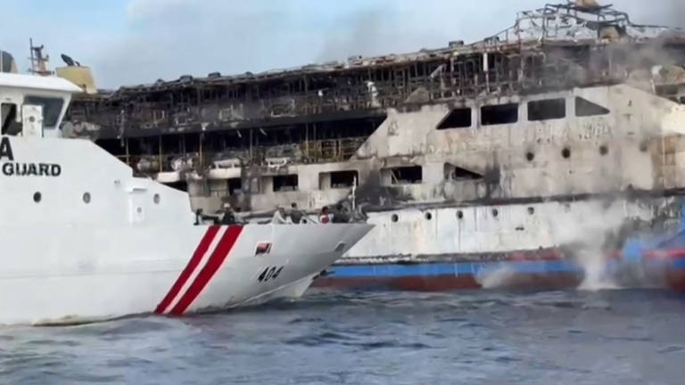 This screen grab taken from video released by Indonesia's National Search and Rescue Agency (BASARNAS) and the Indonesian Coast Guard shows the KM Barcelona 5 ferry after a fire broke out while on its way to Manado, the capital of North Sulawesi province. - AFP PHOTO / Indonesia's National Search and Rescue Agency (BASARNAS) / Indonesian Coast Guard