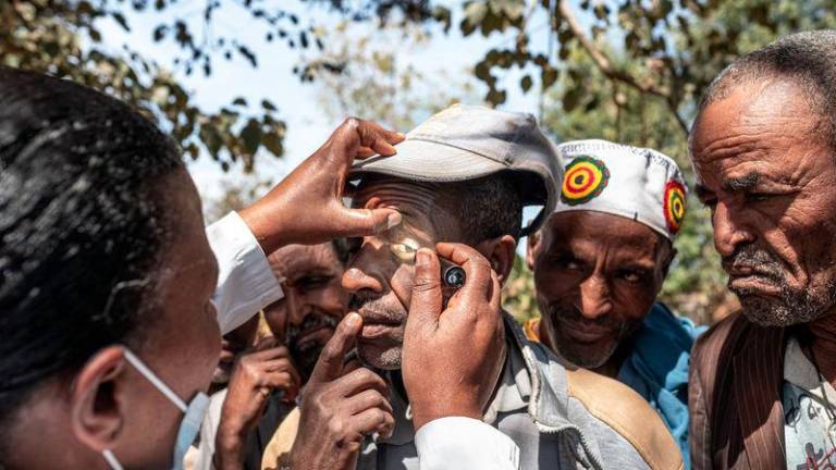 Members of the community undergo check-ups to determine if they are affected by trachoma in a village near Butajira, on January 16, 2025. - AFPPIX