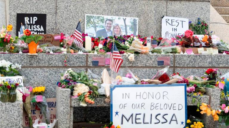 Flowers and hand-written sit at a memorial outside the Minnesota State Capitol in honor of Democratic state assemblywoman Melissa Hortman and her husband Mark, after a gunman killed them, in St. Paul, Minnesota, U.S., June 15, 2025. REUTERSpix