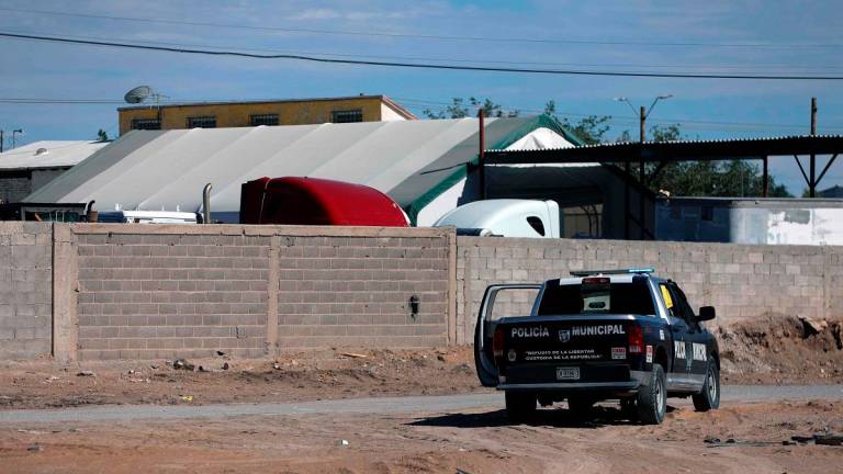 A Municipal Police vehicle remains outside the crematorium where authorities found 381 corpses embalmed in Ciudad Juarez, Chihuahua state, Mexico, on June 29, 2025. - AFPpix
