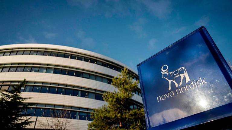(FILES) The logos of Danish drugmaker Novo Nordisk, maker of the blockbuster diabetes and weight-loss treatments Ozempic and Wegovy is seen outside theri building as the company presents the annual report at Novo Nordisk in Bagsvaerd, Denmark, on February 5, 2025. - Mads Claus Rasmussen / RITZAU SCANPIX / AFP