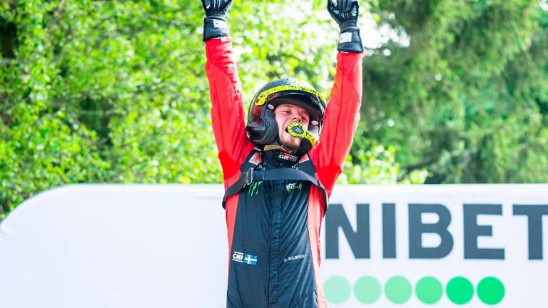 Overall winner Swedish Oliver Solberg celebrates on the podium after winning the Rally Estonia, the eighth round of the FIA World Rally Championship, on July 20, 2025 in Kaariku, Estonia. - TIMO ANIS / AFP