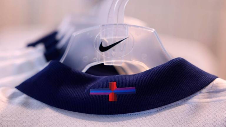 Racks of England’s new Nike designed football shirt, with the controversial St George’s cross, are displayed for sale in a central London store on March 22, 2024/AFPPix