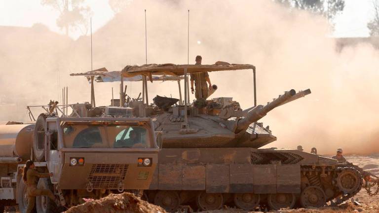 This picture taken from a position at Israel’s border with the Gaza Strip on July 23, 2025 shows Israeli troops deploy at the border with the besieged Palestinian territory. - AFP