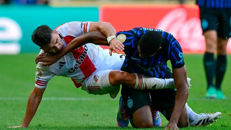 River Plate’s Argentine defender #21 Marcos Acuna with Inter Milan’s Dutch defender #02 Denzel Dumfries after the FIFA Club World Cup 2025 Group E football match between Italy’s Inter Milan and Argentina’s River Plate at the Lumen Field stadium in Seattle on June 23, 2025. AFPpix