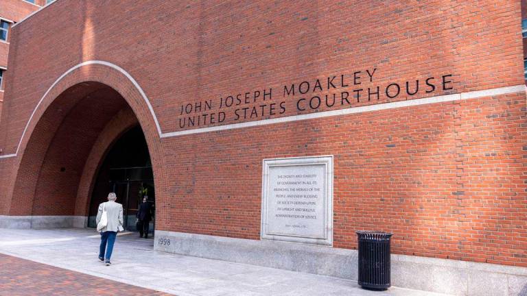 A person walks into John Joseph Moakley United Stats Courthouse on July 21, 2025 in Boston, Massachusetts - Scott Eisen/Getty Images/AFPPix