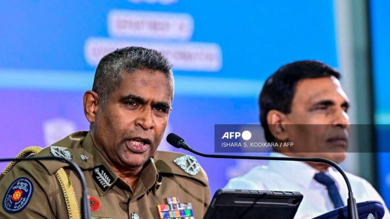 Sri Lanka’s Inspector General of Police Priyantha Weerasooriya (L) speaks as Minister of Public Security Ananda Wijepala looks on during a press conference in Colombo on August 28, 2025. Sri Lanka’s most wanted man has been arrested in Indonesia and will be extradited to face charges including gunning down a rival inside a court, officials said August 28. Public Security Ministry Secretary Ravi Seneviratne said Indonesian police had detained six Sri Lankans linked to several murders and organised drug-related crimes. (Photo by Ishara S. KODIKARA / AFP