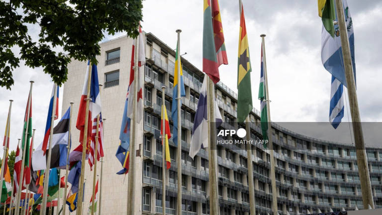 This photograph taken on July 23, 2025 shows flags flying in front of the United Nations Educational, Scientific and Cultural Organisation (UNESCO) headquarters in Paris. - AFP
