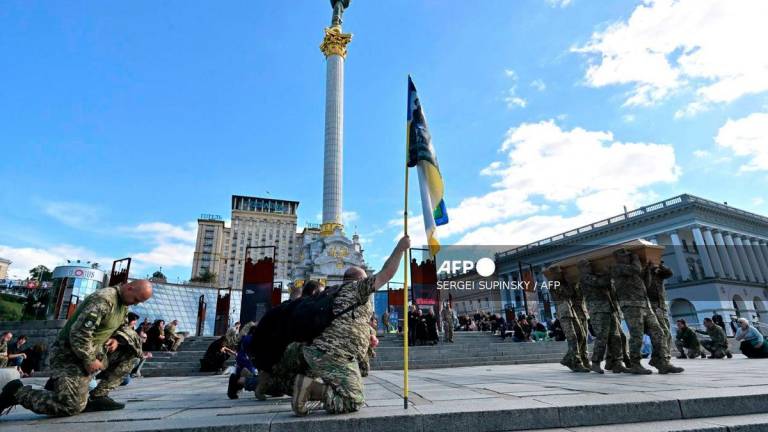 Soldiers carry a coffin with the body of the Ukrainian serviceman with the call sign Bes during the funeral ceremony at Independence Square in Kyiv on September 20, 2025, amid Russian invasion in Ukraine. - AFP