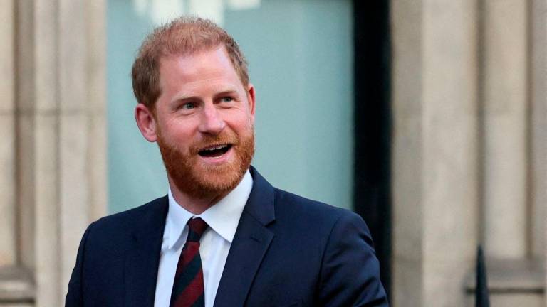 FILE PHOTO: Britain’s Prince Harry departs after attending court for his appeal against the rejection of his legal challenge to the British government’s decision to take away his police protection when he is in Britain, outside the High Court in London, Britain, April 9, 2025. REUTERS/Isabel Infantes/File Photo