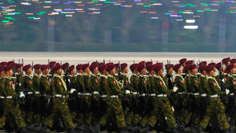 Myanmar junta military soldiers parade during a ceremony to mark the country’s Armed Forces Day in Naypyidaw on March 27, 2025. Myanmar’s junta chief insisted on March 27 that a planned election will go ahead despite the country’s spiralling civil war, in a speech to thousands of soldiers and dignitaries at the annual Armed Forces Day parade. (Photo by AFP)