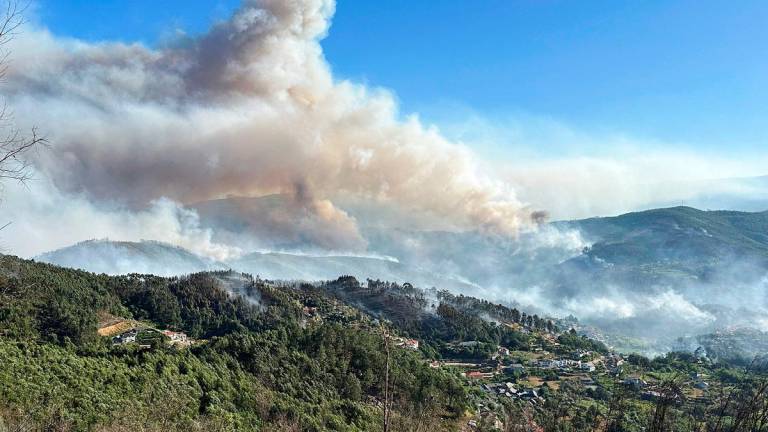 Smoke from a wildfire rises over the hills near the village of Canelas, Arouca region, Portugal, July 29, 2025. - REUTERS/Miguel Pereira
