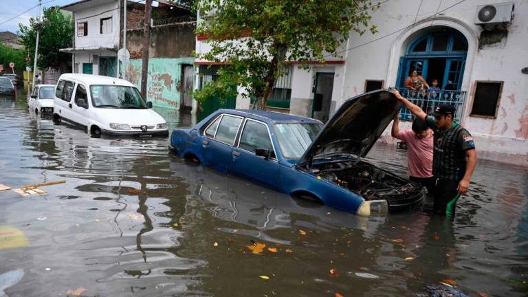 A flooded street in Avellaneda, Buenos Aires Province, Argentina, on Tuesday, following heavy rains in the area. Storms flooded parts of Buenos Aires and the surrounding area, causing flight delays, leaving vehicles under water and preventing businesses from opening. – AFPpic