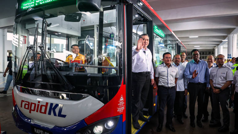 Transport Minister Anthony Loke (left), together with the President and Chief Executive Officer of Prasarana Group, Mohd Azharuddin Mat Sah (second from left), at the launch event for the new Rapid KL and Rapid Penang Diesel Buses at the Batu Caves Rapid Bus Complex today. - BERNAMA
