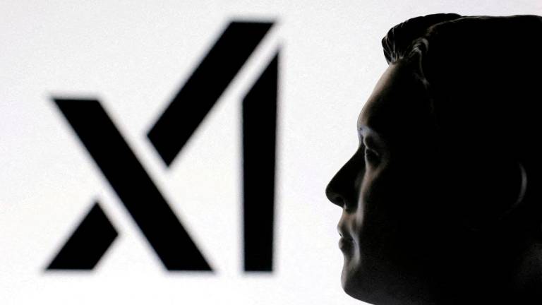A 3D-printed miniature model of Elon Musk and the xAI logo are seen in this illustration taken January 23, 2025. REUTERSPix