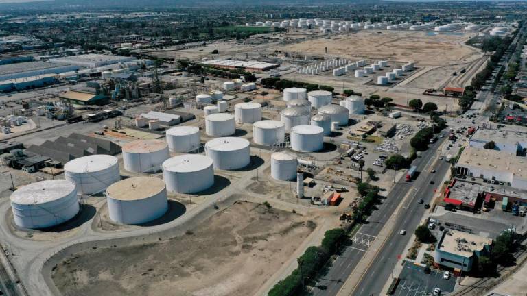 FILE PHOTO: An aerial view of storage tanks at the Kinder Morgan Watson Station, a gathering system for oil and refined petroleum product pipelines, in Long Beach, California, U.S., March 11, 2022. Picture taken with a drone. REUTERS