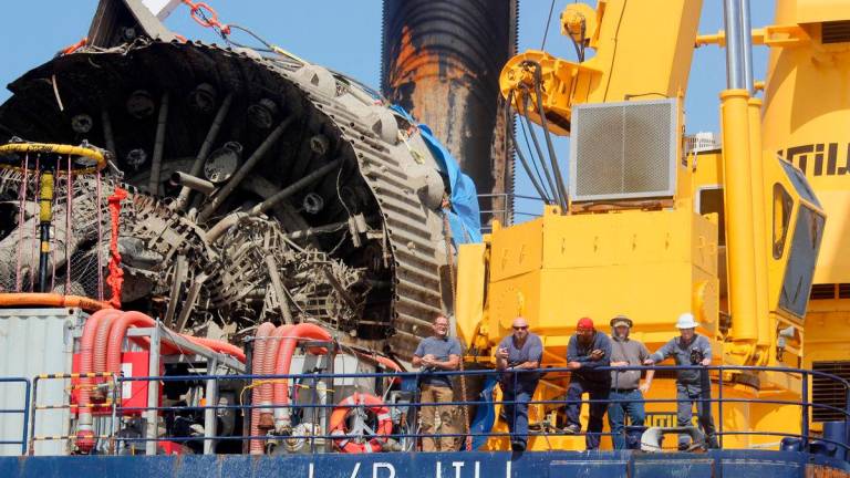 FILE PHOTO: Workers stand on the SEACOR Marine 335 Class L/B Jill liftboat as they transport debris from a SpaceX rocket, which exploded during a routine ground test at Starbase, the company’s launch facility on the south Texas coast near the Mexican border, offshore from Matamoros, Mexico, July 20, 2025. REUTERS/Abraham Pineda/File Photo