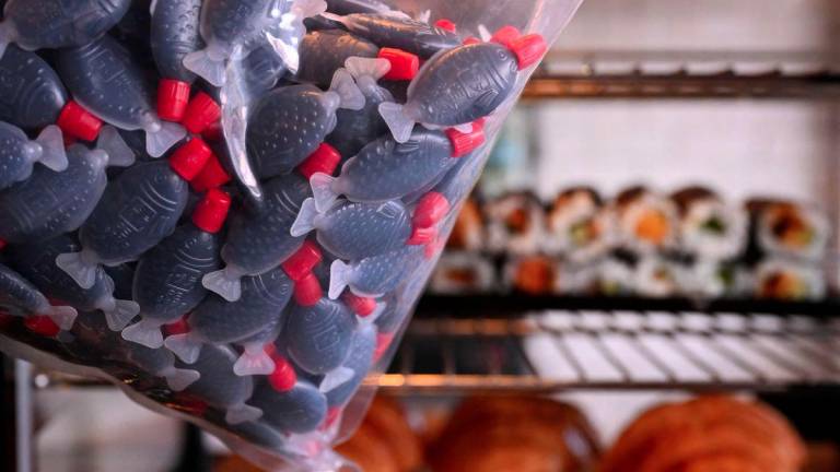 A photo taken on September 2, 2025 shows plastic fish-shaped soy sauce containers in a Melbourne cafe as South Australia bans the containers as part of a state crackdown on single-use plastic. - AFPPIX