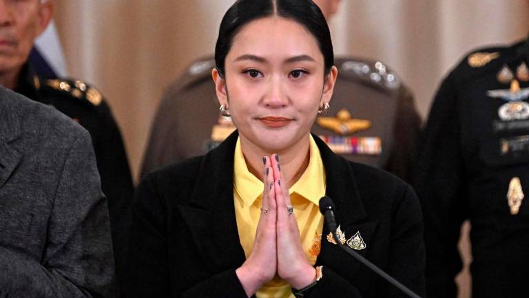 Thailand’s Prime Minister Paetongtarn Shinawatra (C). - Lillian SUWANRUMPHA / AFP