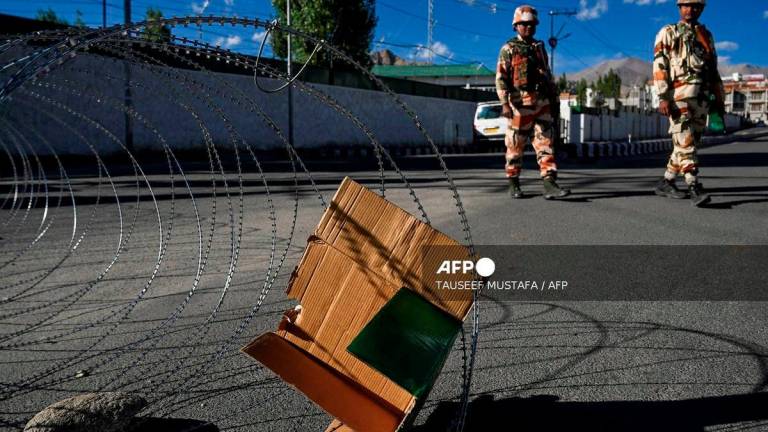 Indo-Tibetan Border Police (ITBP) personnel patrol along a road during a curfew after unrest in Leh on September 26, 2025. - AFP